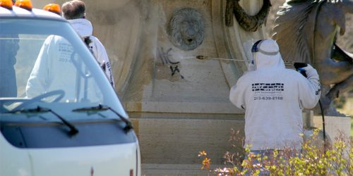 removing graffiti from a fountain