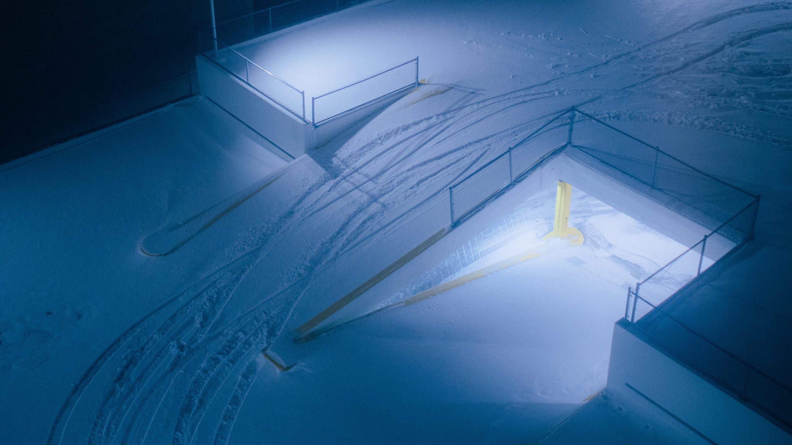 photo of a parking garage covered in snow