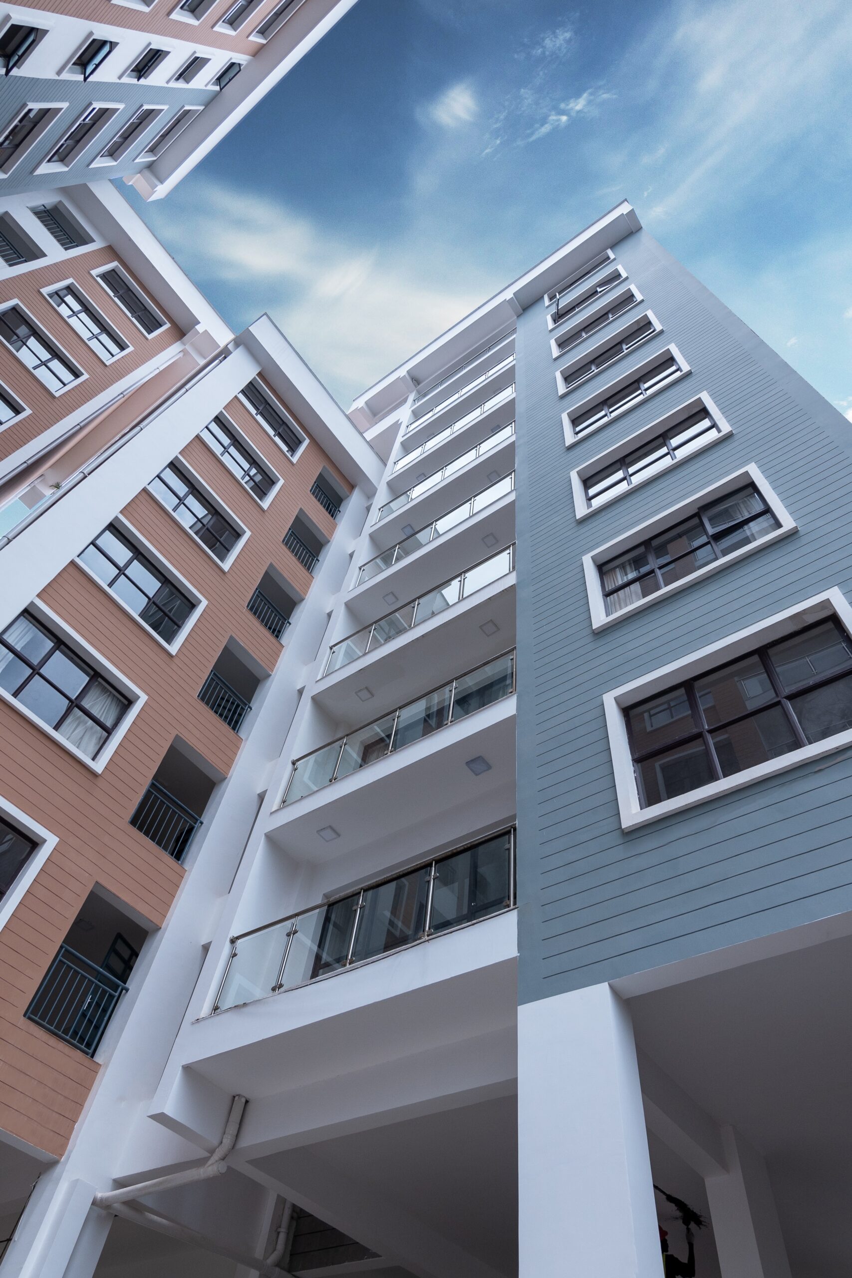 background image of a freshly power washed apartment building