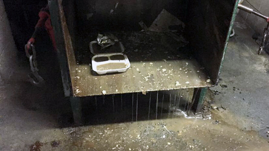 photo of a dirty trash chute before cleaning