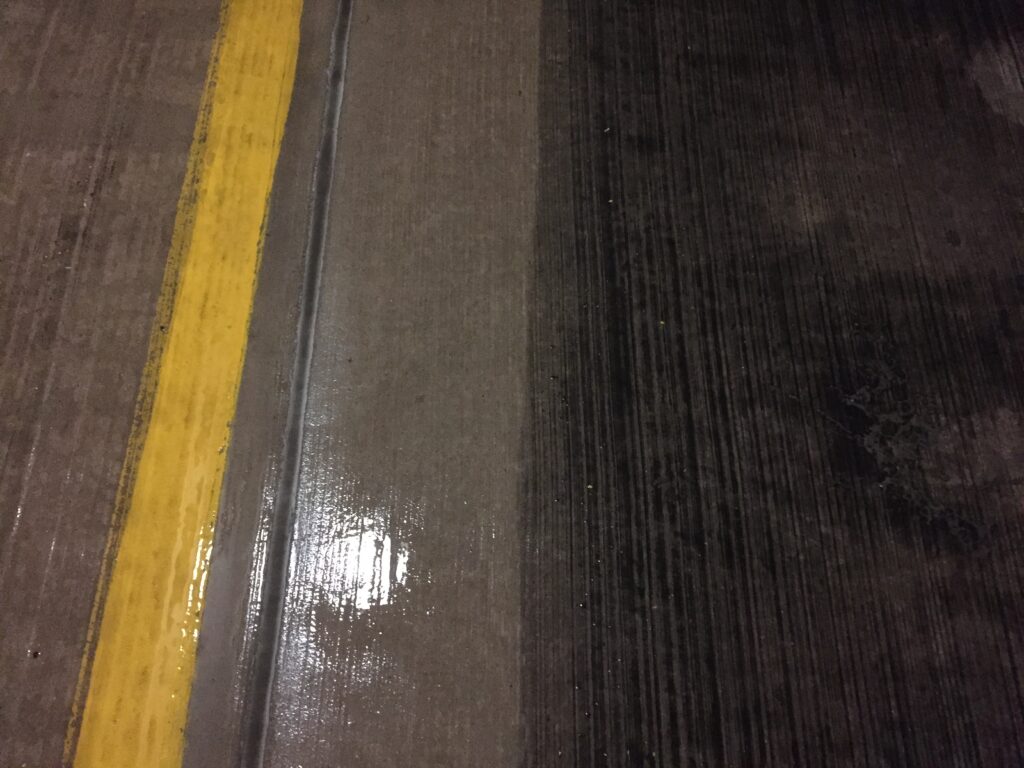 This is a contrast between an are of a parking garage that we cleaning and didn't clean. let OFF THE WALL do your parking garage cleaning in CT, RI and MA