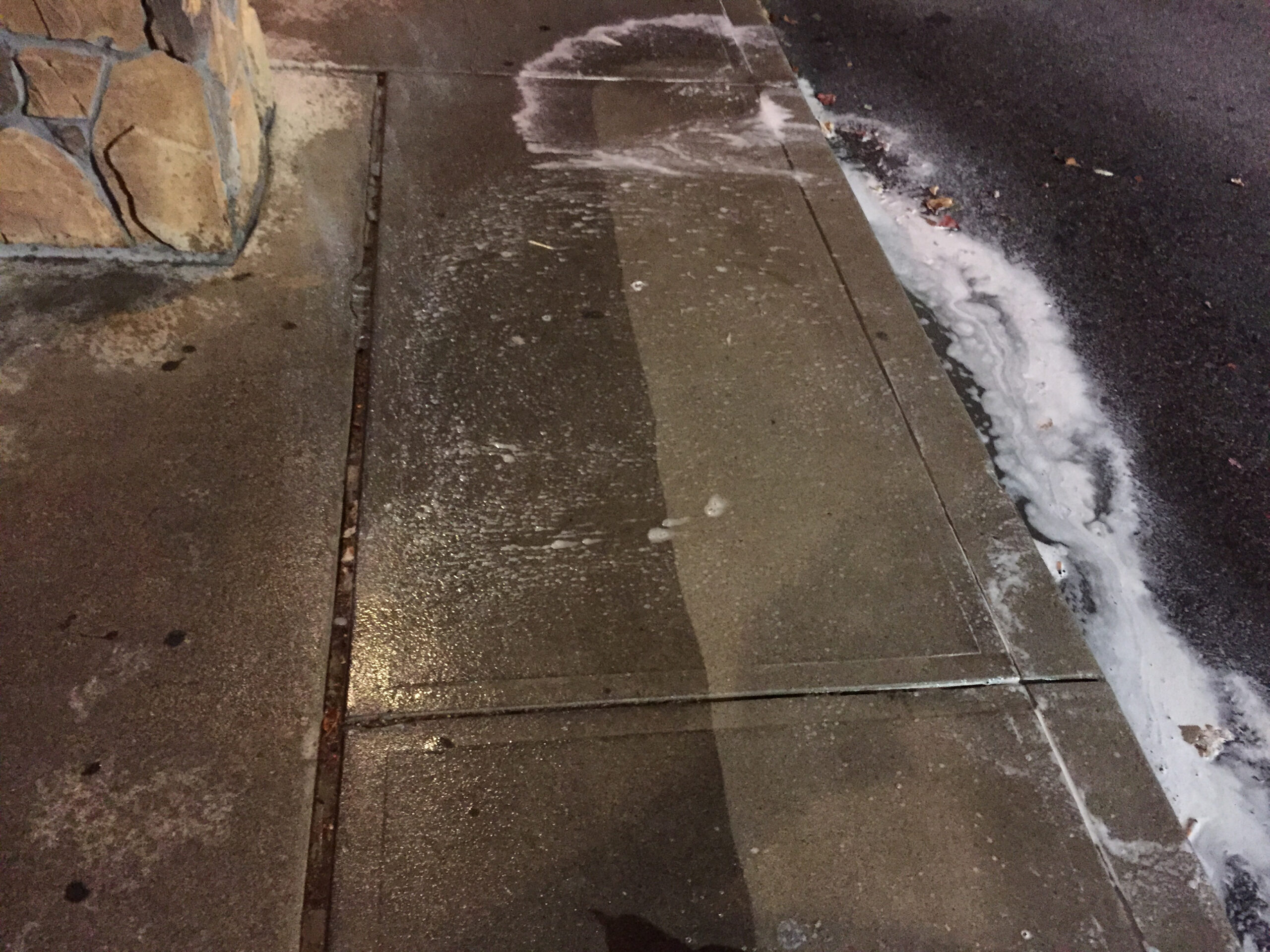 Photograph of the removal of concrete sidewalk stains