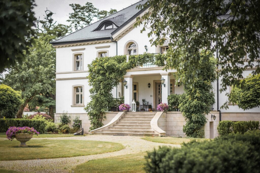 photograph of a bright and clean exterior of a large residence