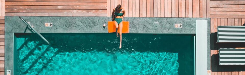 Swimmer lounging on a freshly cleaned pool deck