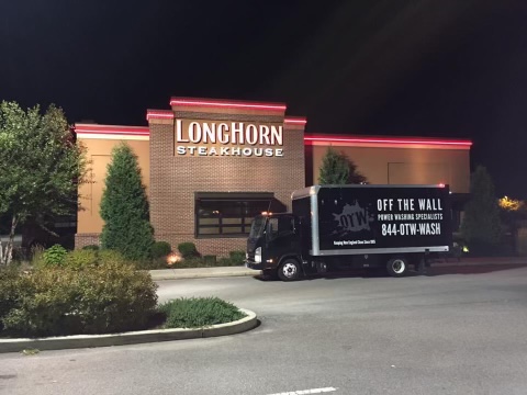photo of the OFF THE WALL Power Washing truck parked in front of a Longhorn Steakhouse restaurant