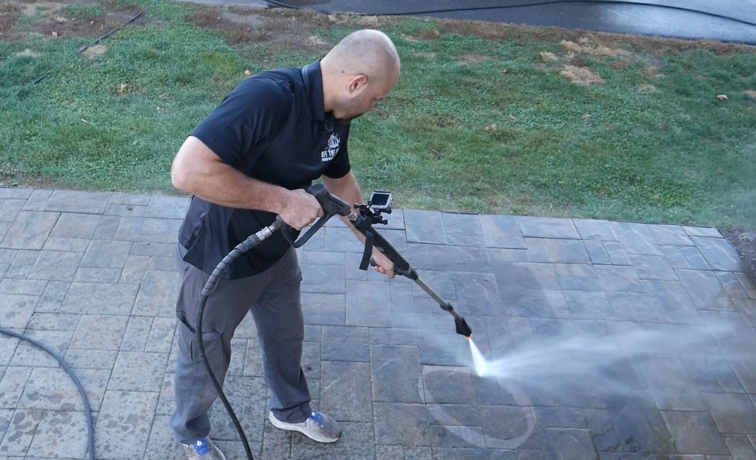 photo of power washing a sidewalk