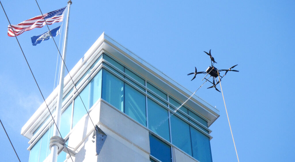 photo of the OFF THE WALL Power Washing drone cleaning the windows of the Goodwin University tower in East Hartford, CT