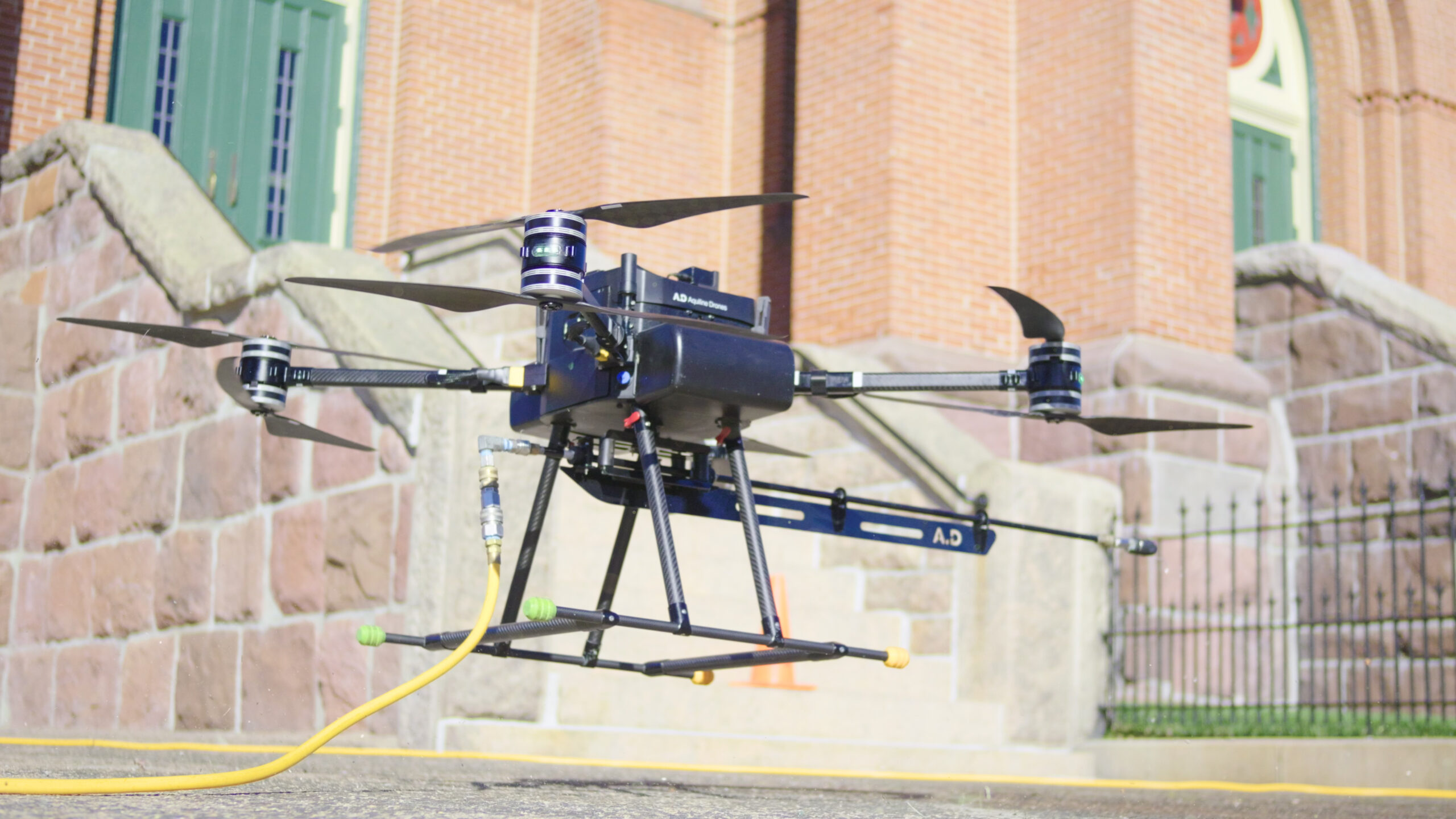 image of a cleaning drone taking off in front of a church in Wallingford, CT