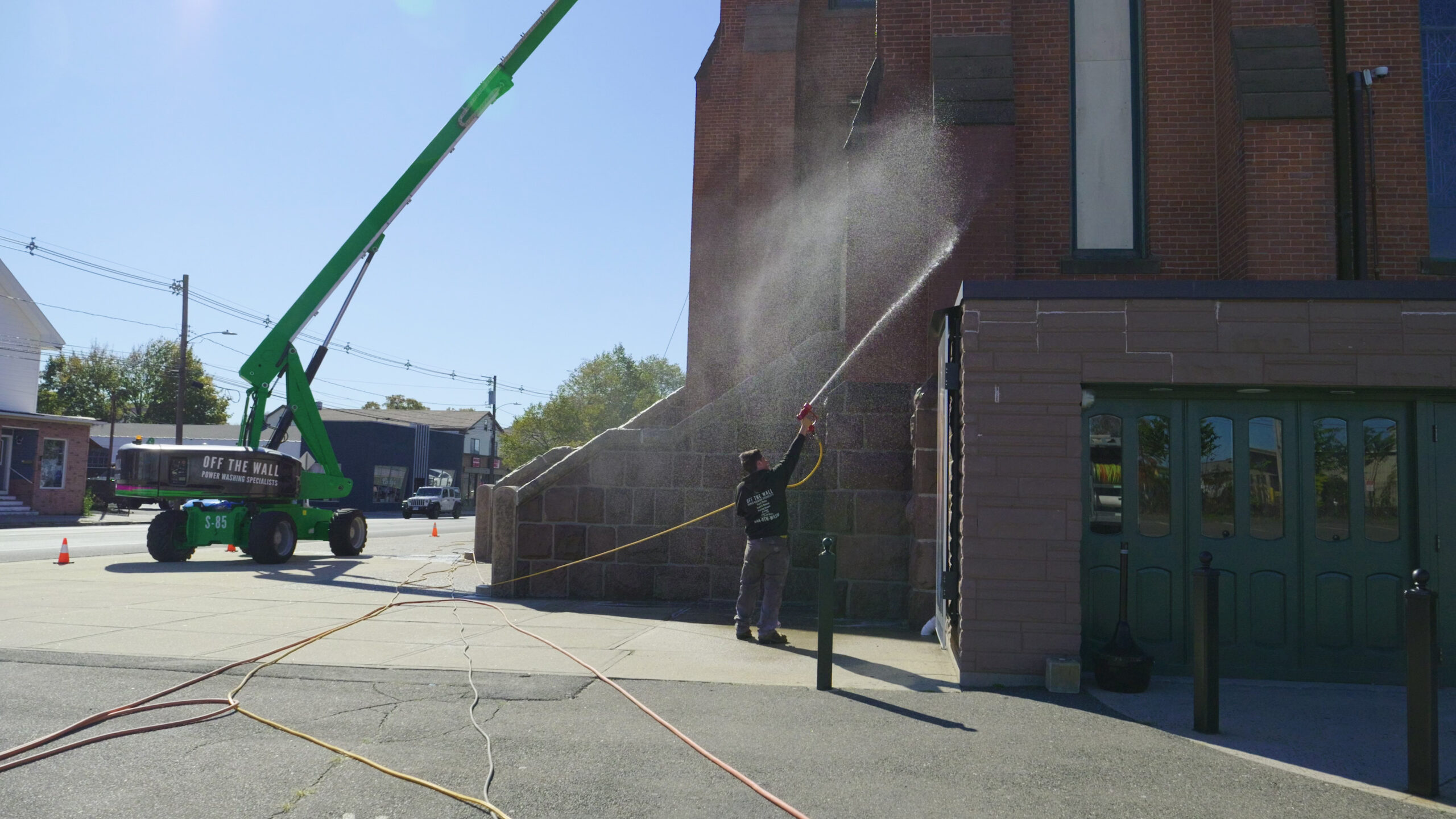 photograph of the OFF THE WALL Power Washing team cleaning the exterior of Most Holy Trinity Church in Wallingford, CT